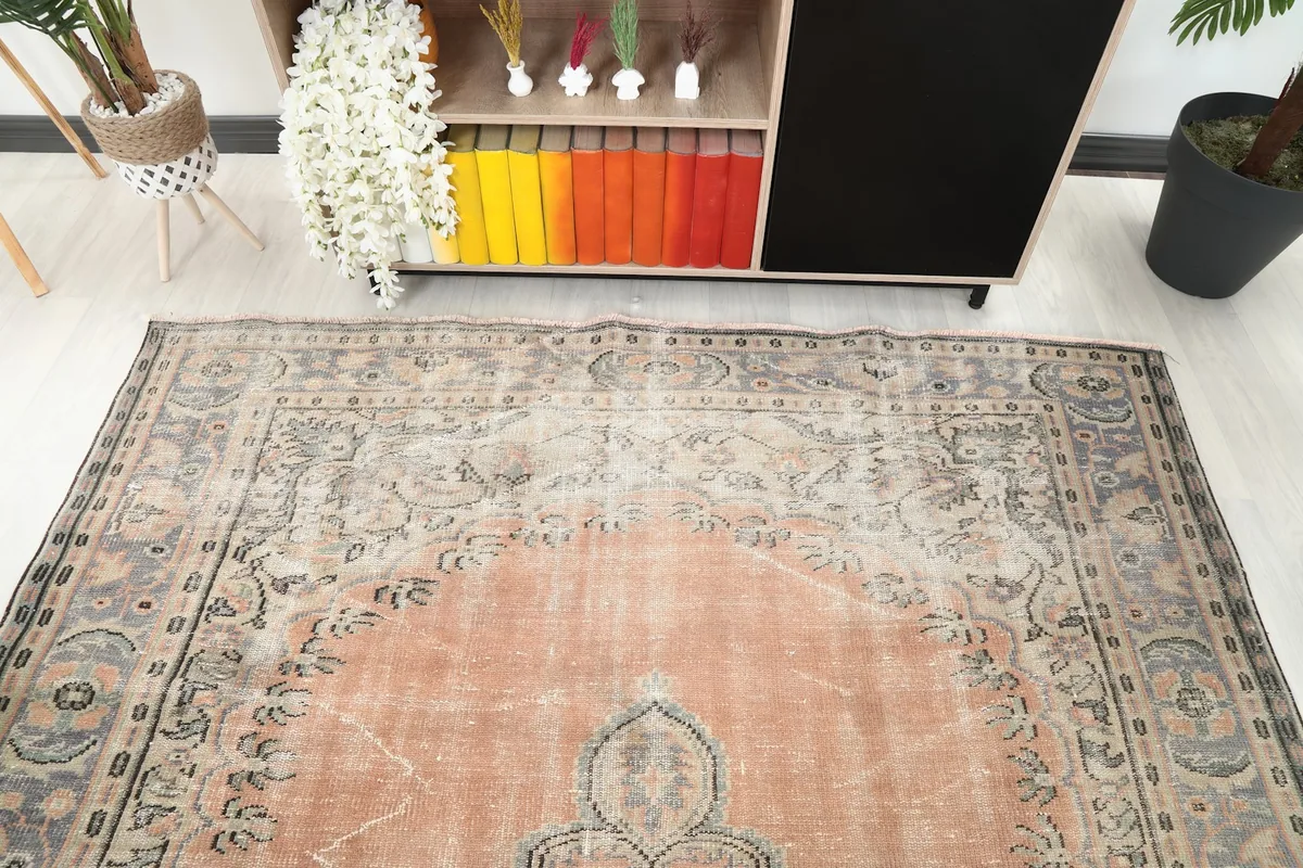Detailed angle view of the rug's border and field, showing color variations