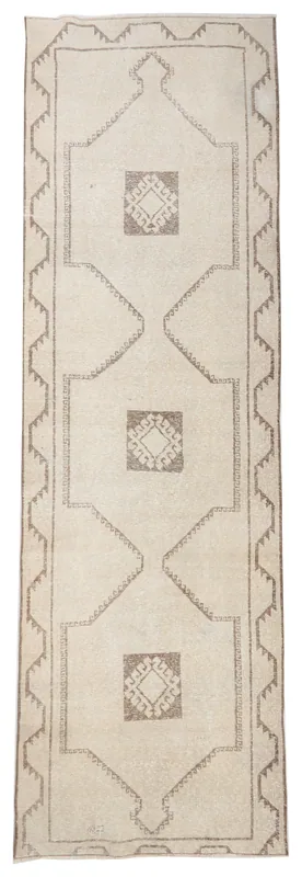 Full top view of the ivory and brown geometric Anatolian runner rug