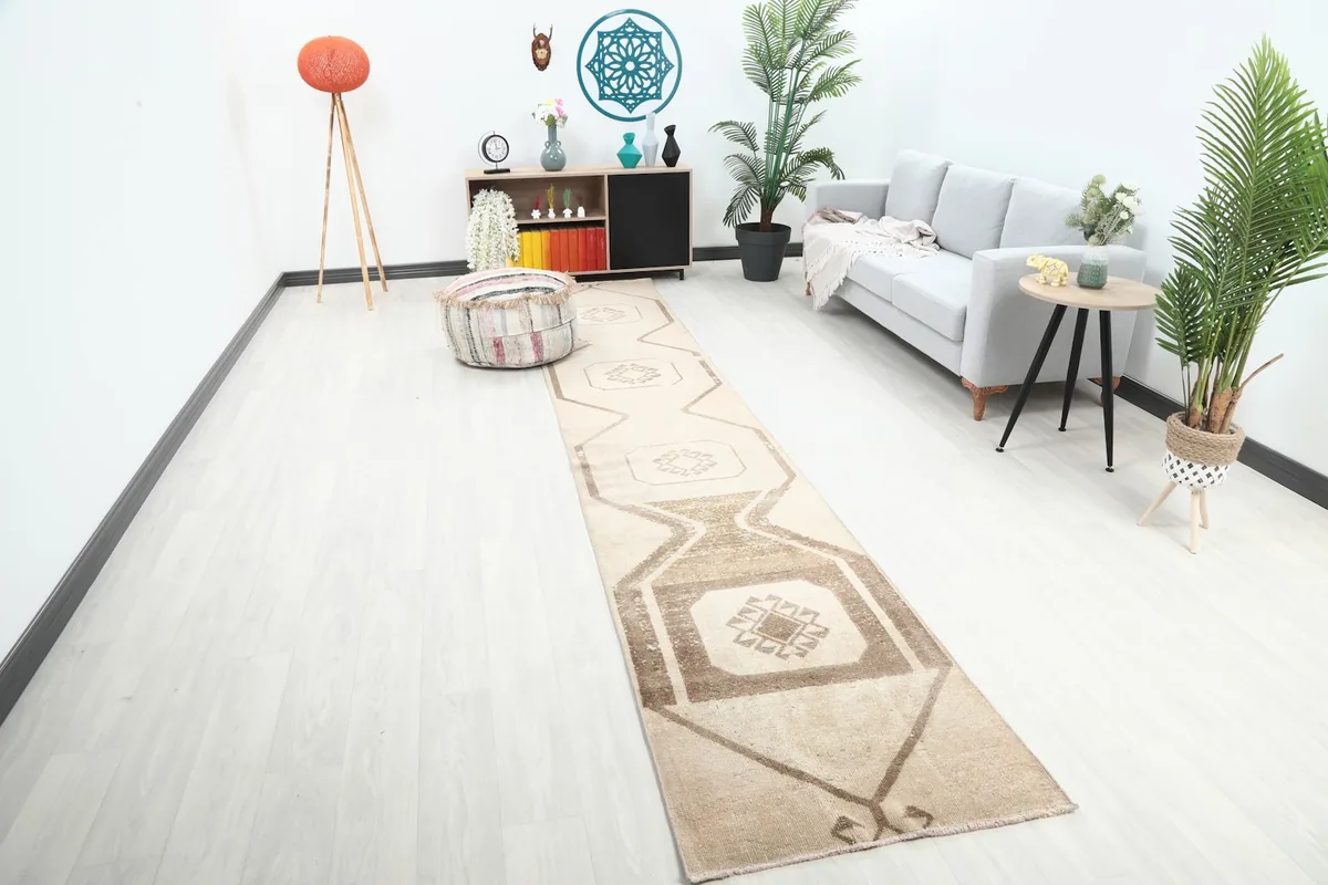Vintage tan and brown runner rug displayed in a modern living room setting