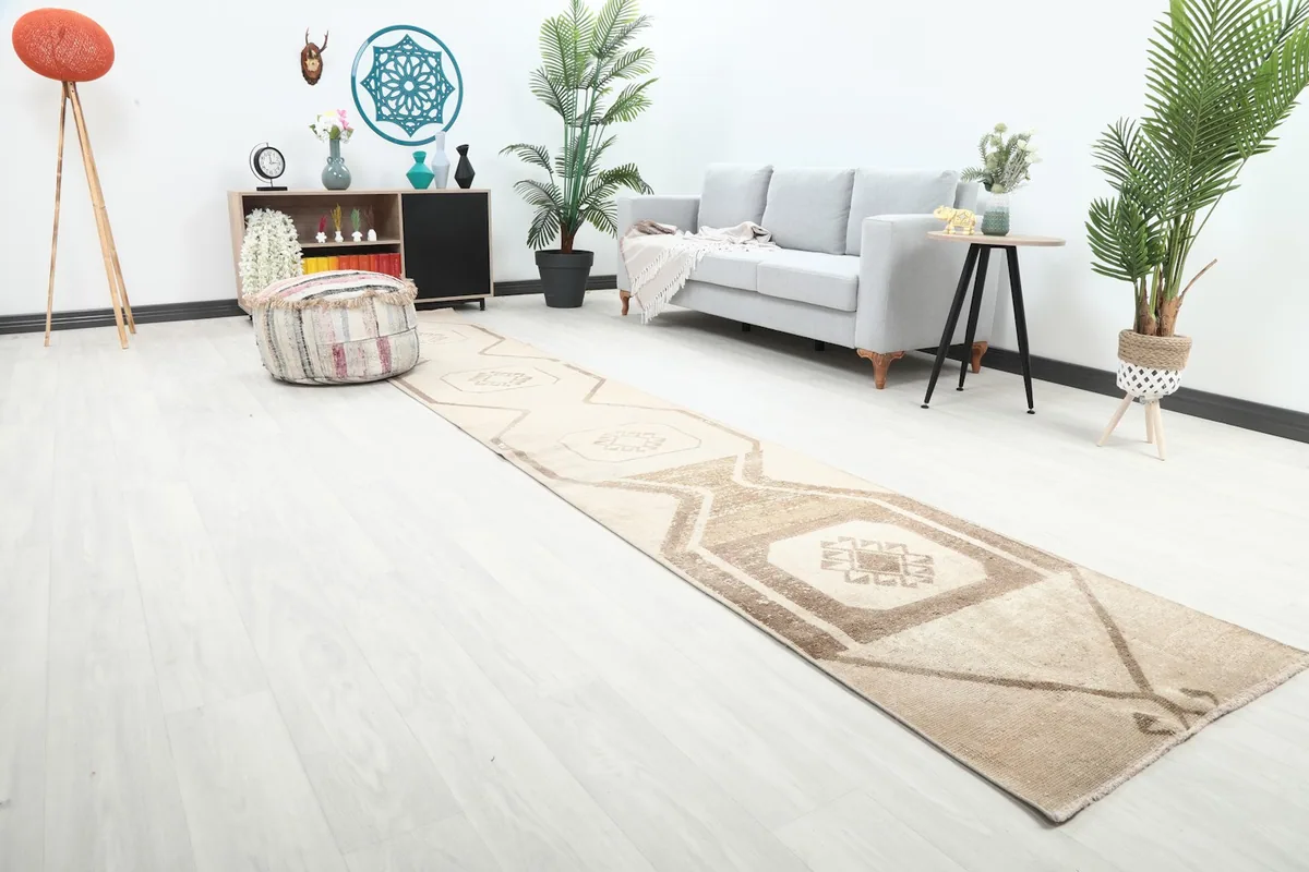 Long view of the tan runner rug extending through a contemporary living space