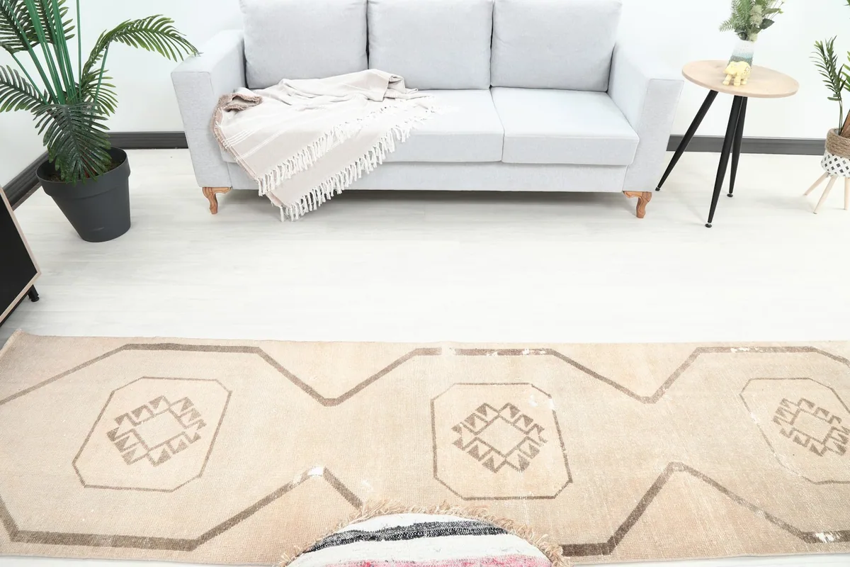 Overhead view of the runner rug's central section, showing repeating medallion motifs