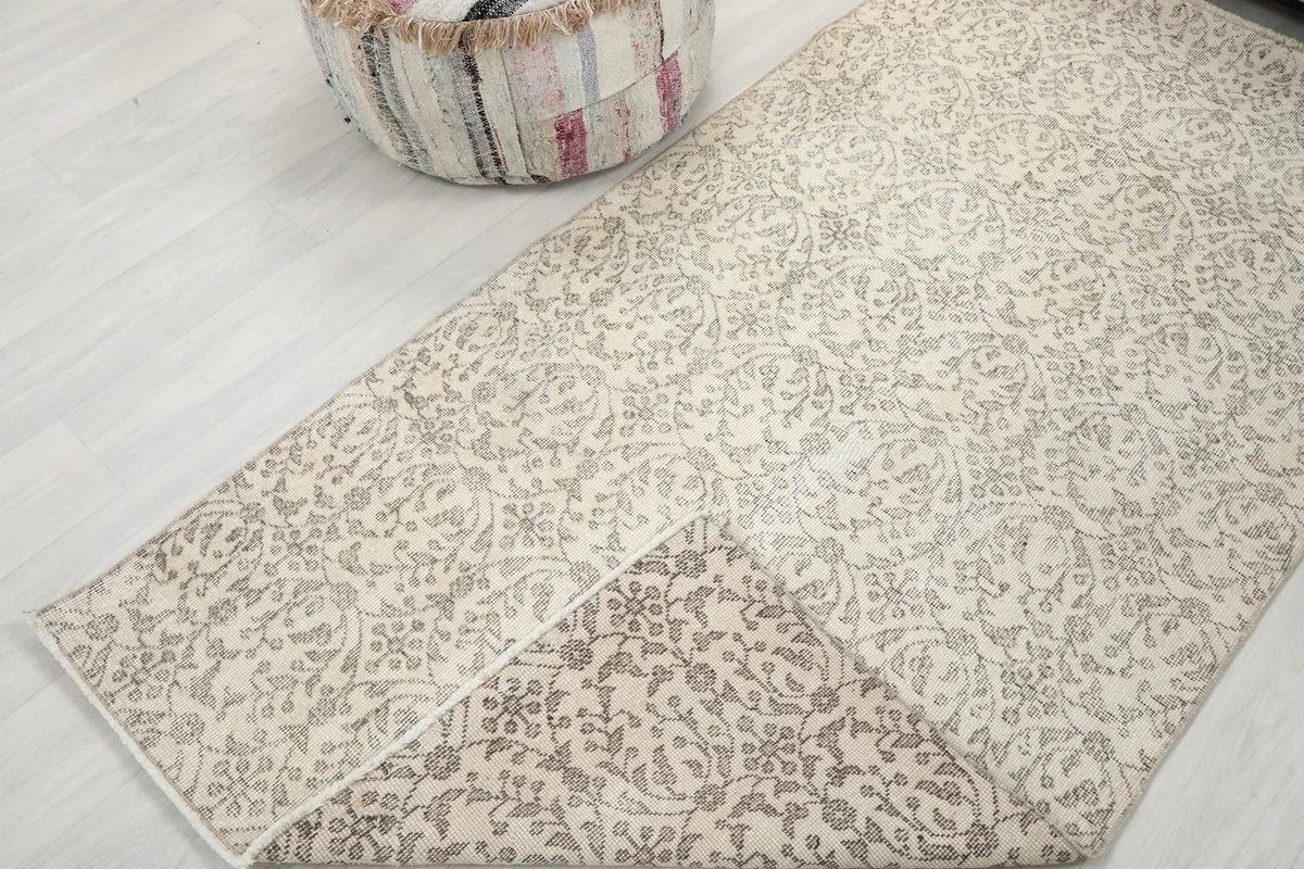 View of the rug folded back, showing the consistent pattern from the top and the underside.
