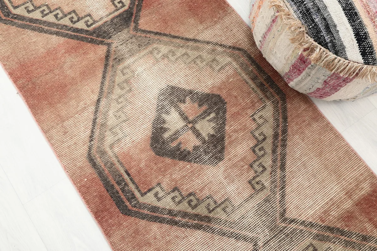Close-up detail of a central geometric medallion with its surrounding border