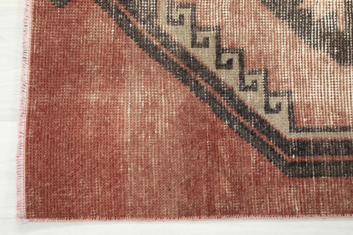 Close-up of the rich rust color and subtle texture at the edge of the runner