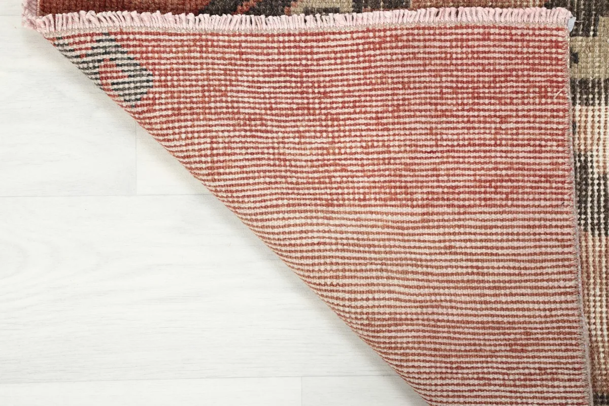 Detailed view of the hand-knotted construction on the back of the runner