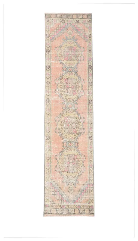 Full top view of the 2'2" x 9'2" rose runner rug with geometric patterns