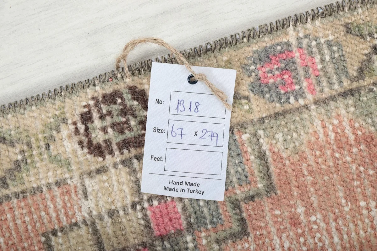Close-up of the rug's corner with a tag showing its size and origin