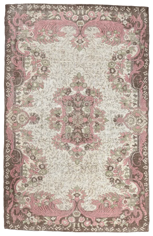 Full top view of the 6'2" x 9'9" vintage Anatolian rug with an ivory field and pink floral medallion.