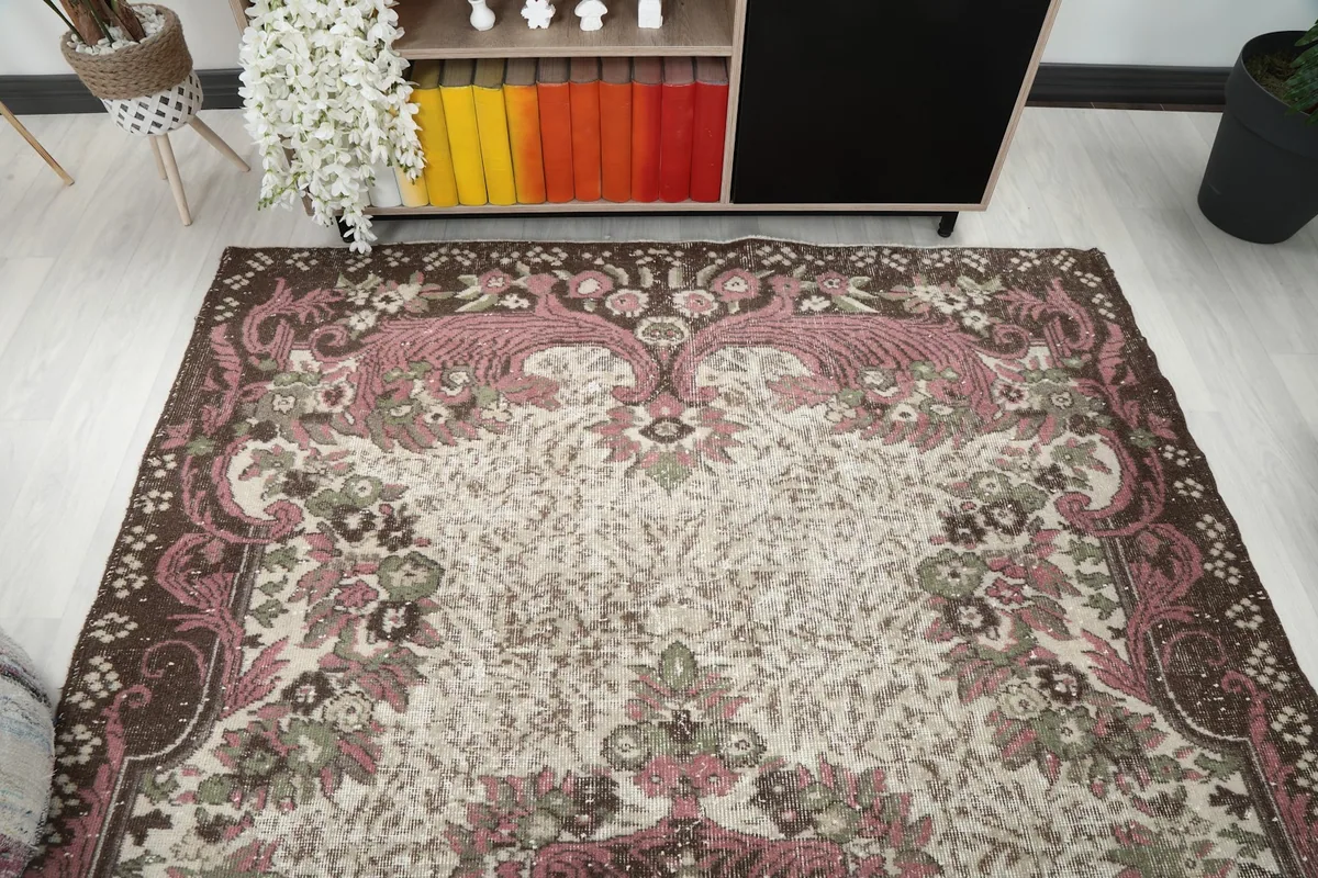 Overhead angle showing the full width of the rug, emphasizing the symmetrical floral design.
