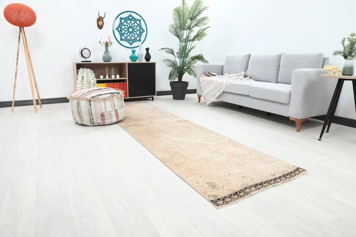 Angle view of the runner rug in a living space, showing its length and pattern