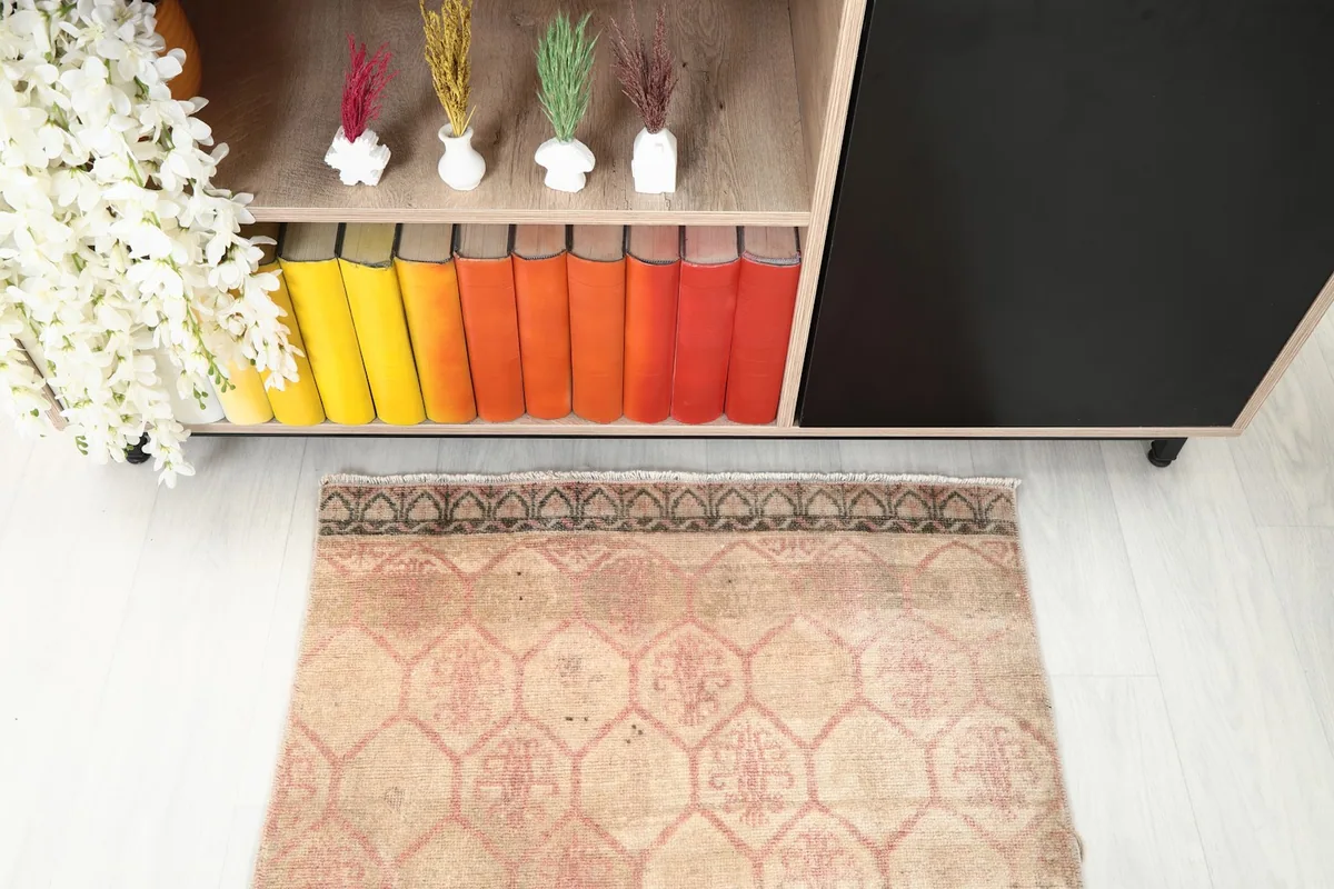 Overhead shot focusing on one end of the runner rug, showing the border design