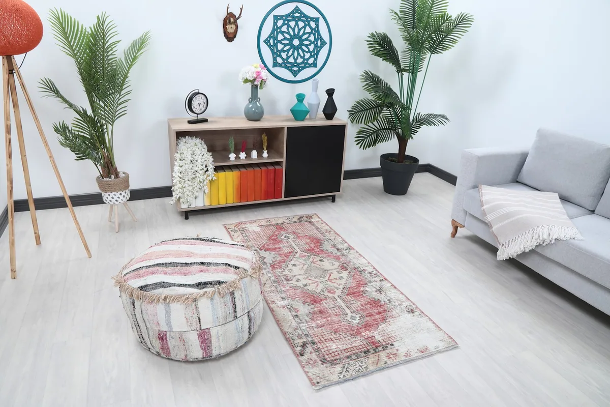 Overhead view of the rug in a room setting, showing its proportions relative to furniture