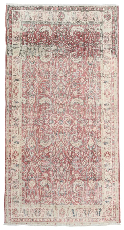 Full overhead view of the rust medallion Anatolian area rug on a white background.