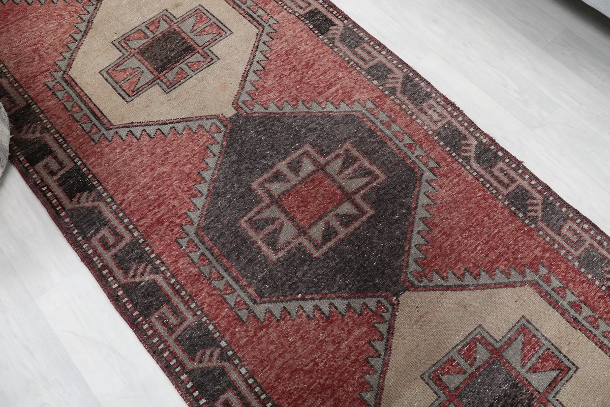 Overhead angle view focusing on the central geometric medallions in beige and brown.