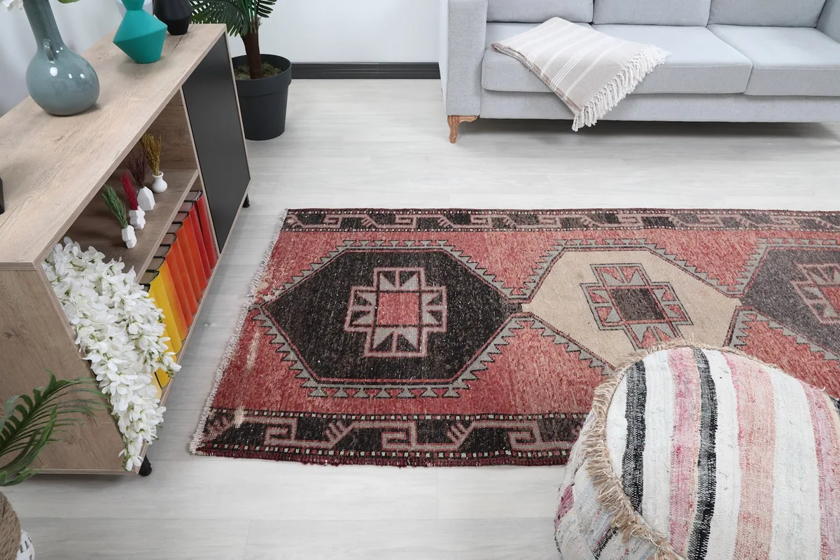 View of the runner rug from a different angle in the room, showcasing its full design.