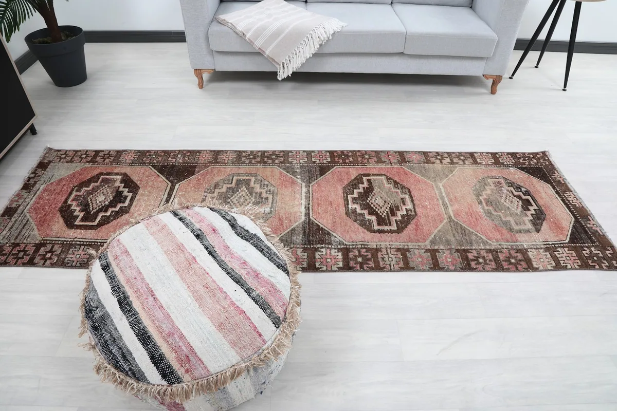 Full length view of the runner rug in the room, from a higher perspective