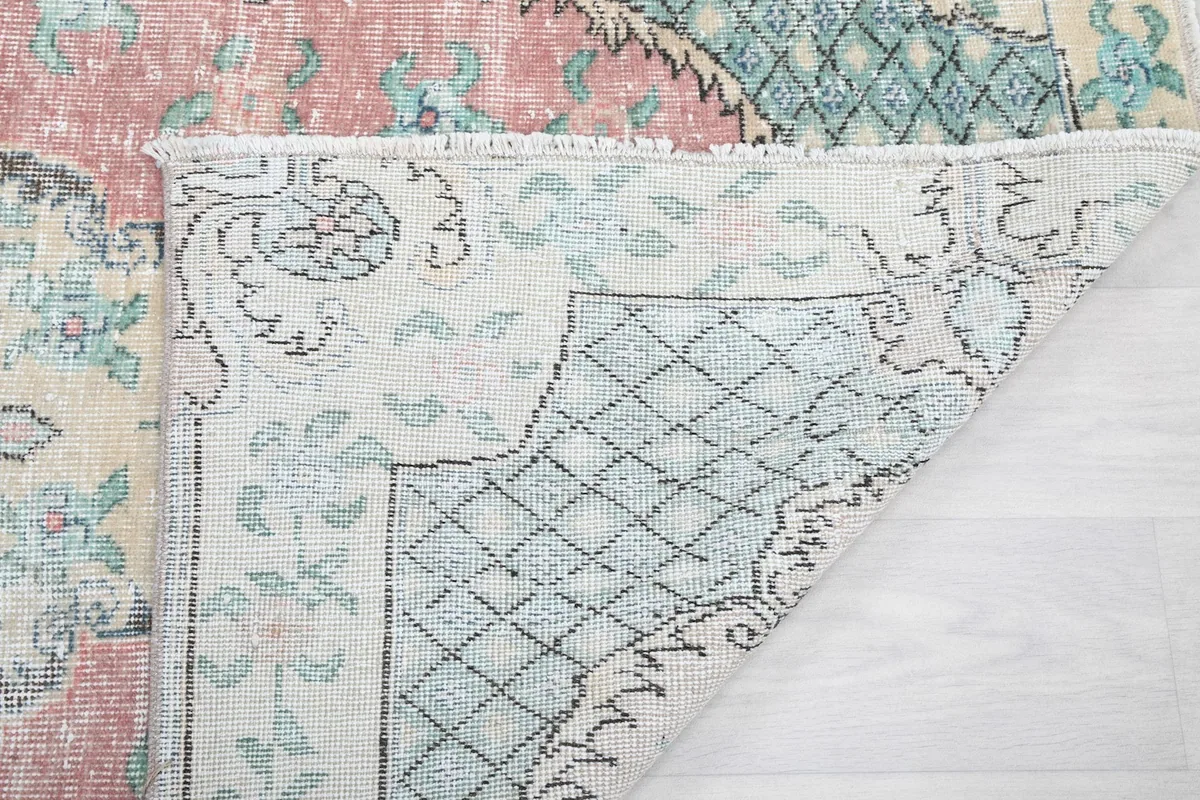 Another view of the folded corner, revealing the craftsmanship and material of the rug