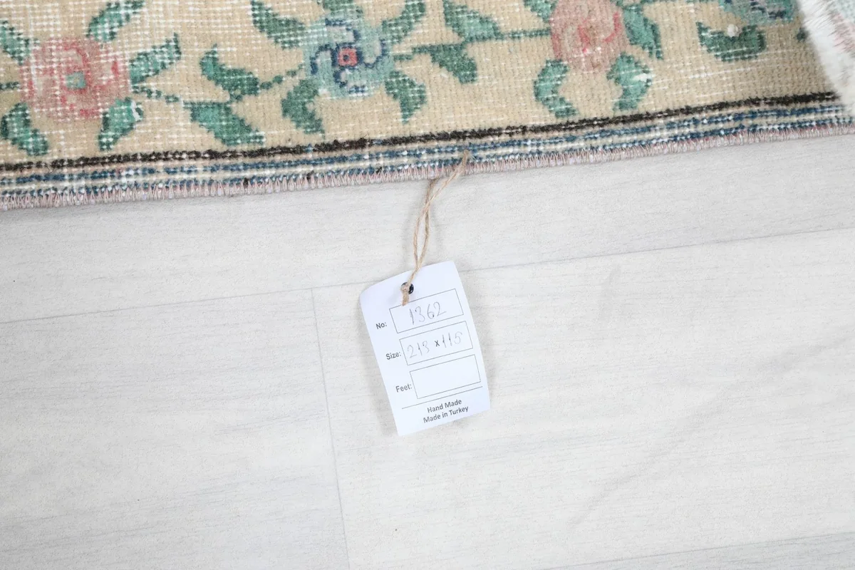Close-up of the product tag attached to the rug, showing size and origin details