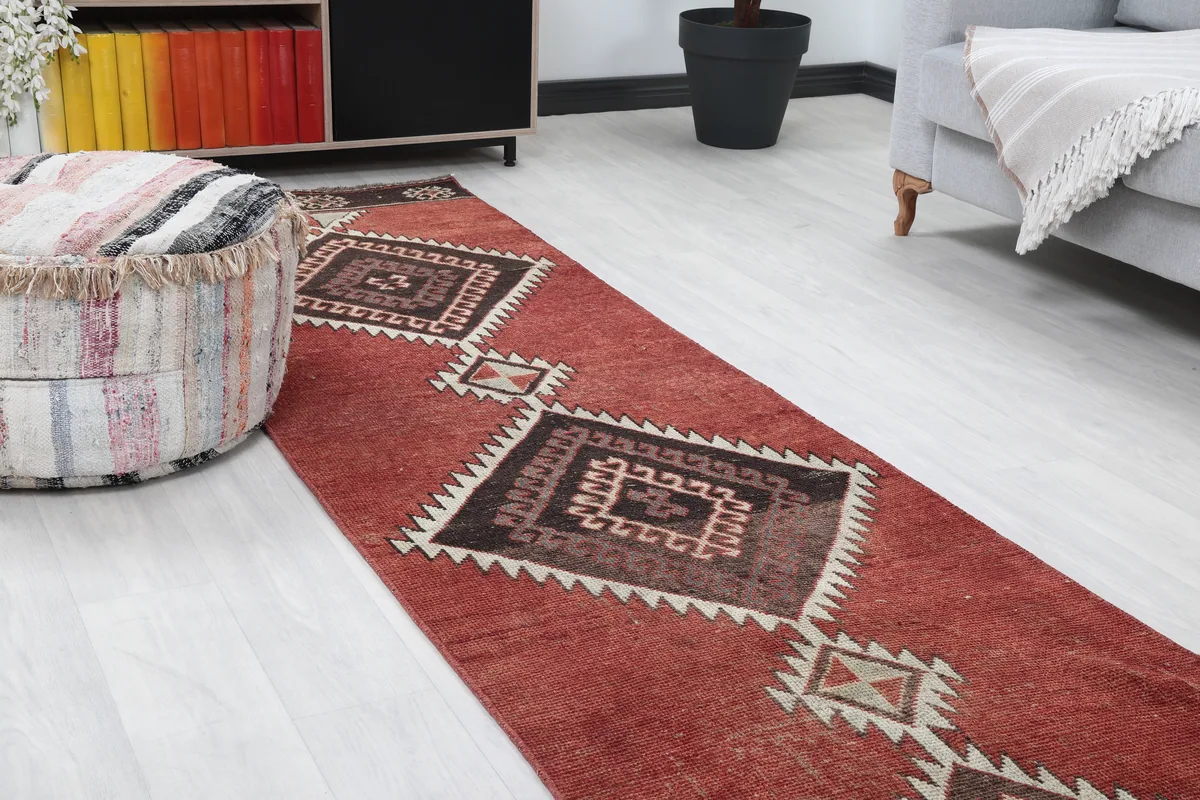 Rustic Red Tribal Diamond Runner, angled view highlighting the central diamond motifs