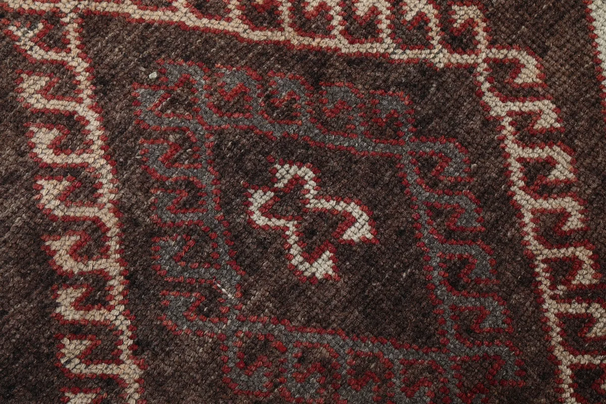 Rustic Red Tribal Diamond Runner, extreme close-up of the wool pile and intricate geometric weaving