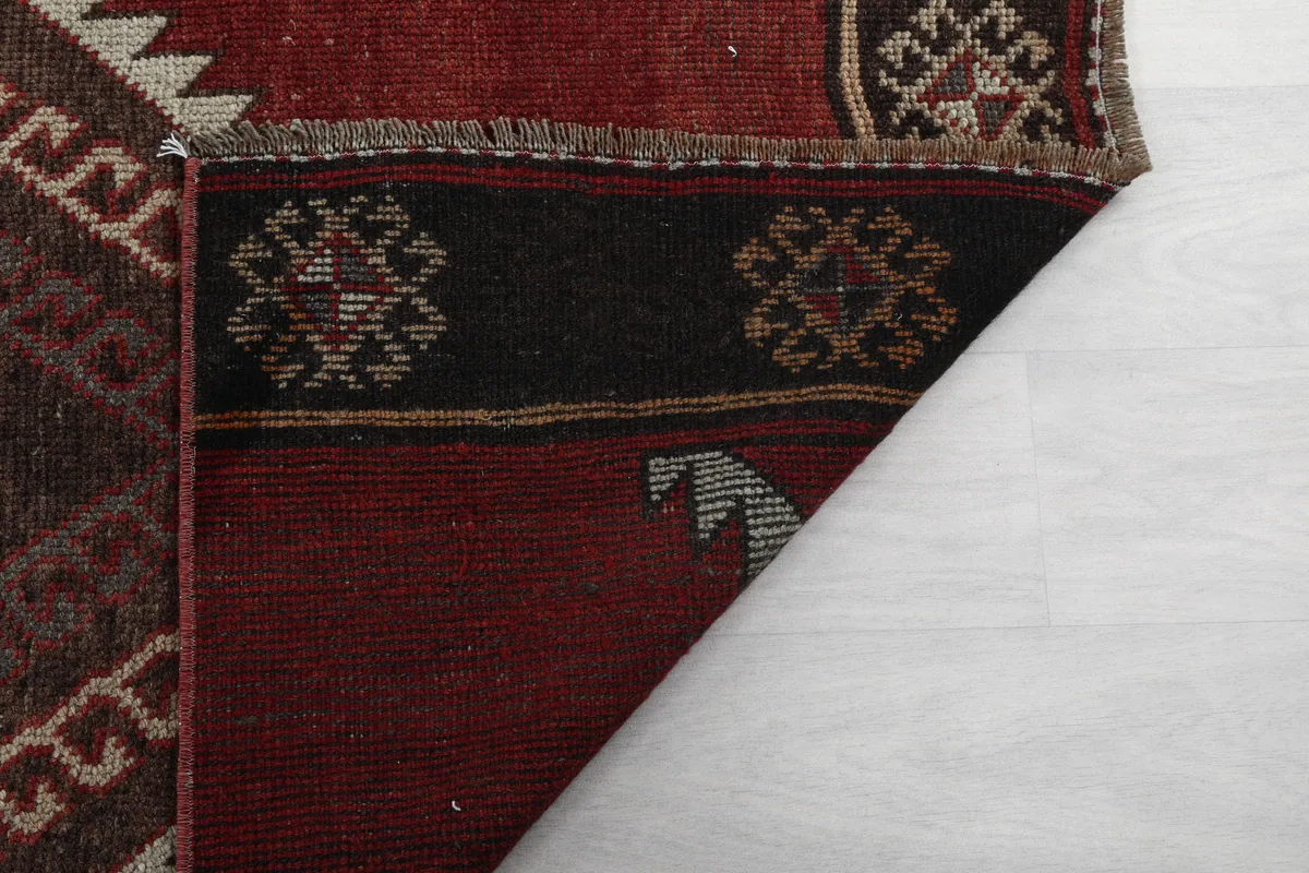 Rustic Red Tribal Diamond Runner, detailed view of the rug's reverse side and fringe