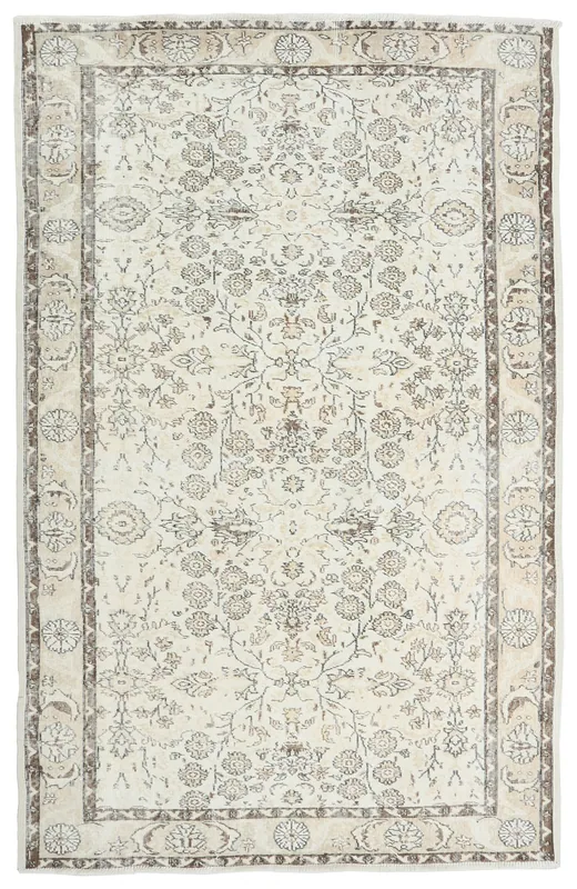 Full overhead view of the 5'7" x 8'8" ivory vintage Anatolian rug with floral motifs
