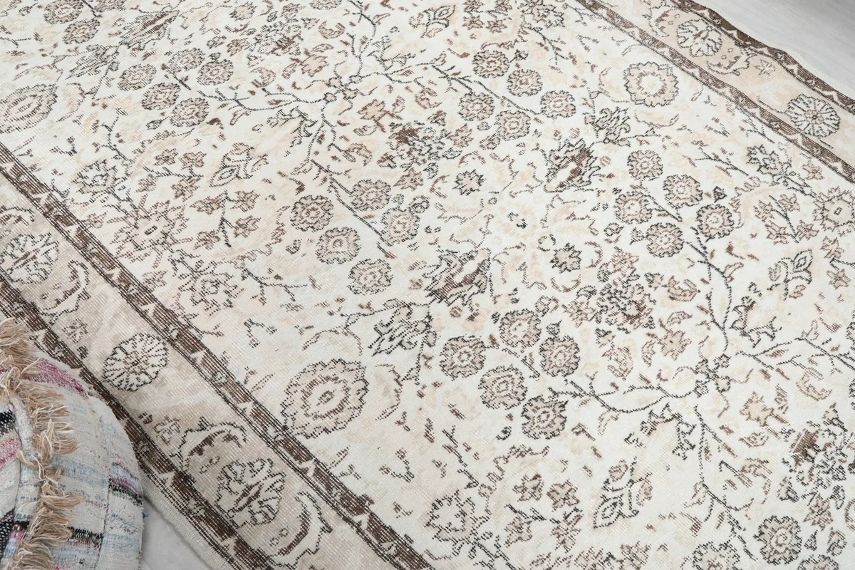 Overhead angle of the vintage wool rug, highlighting its texture and overall pattern