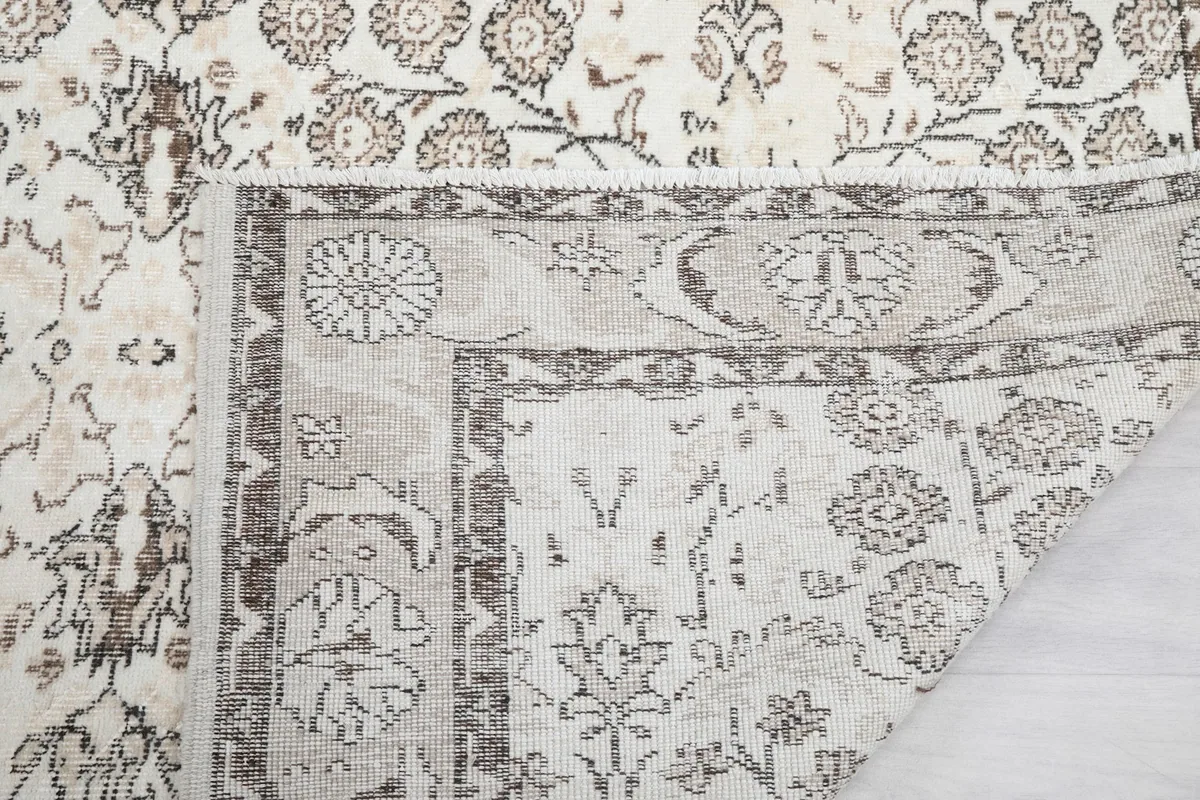 Close-up of the back of the rug, showing the knotting and fringe detail