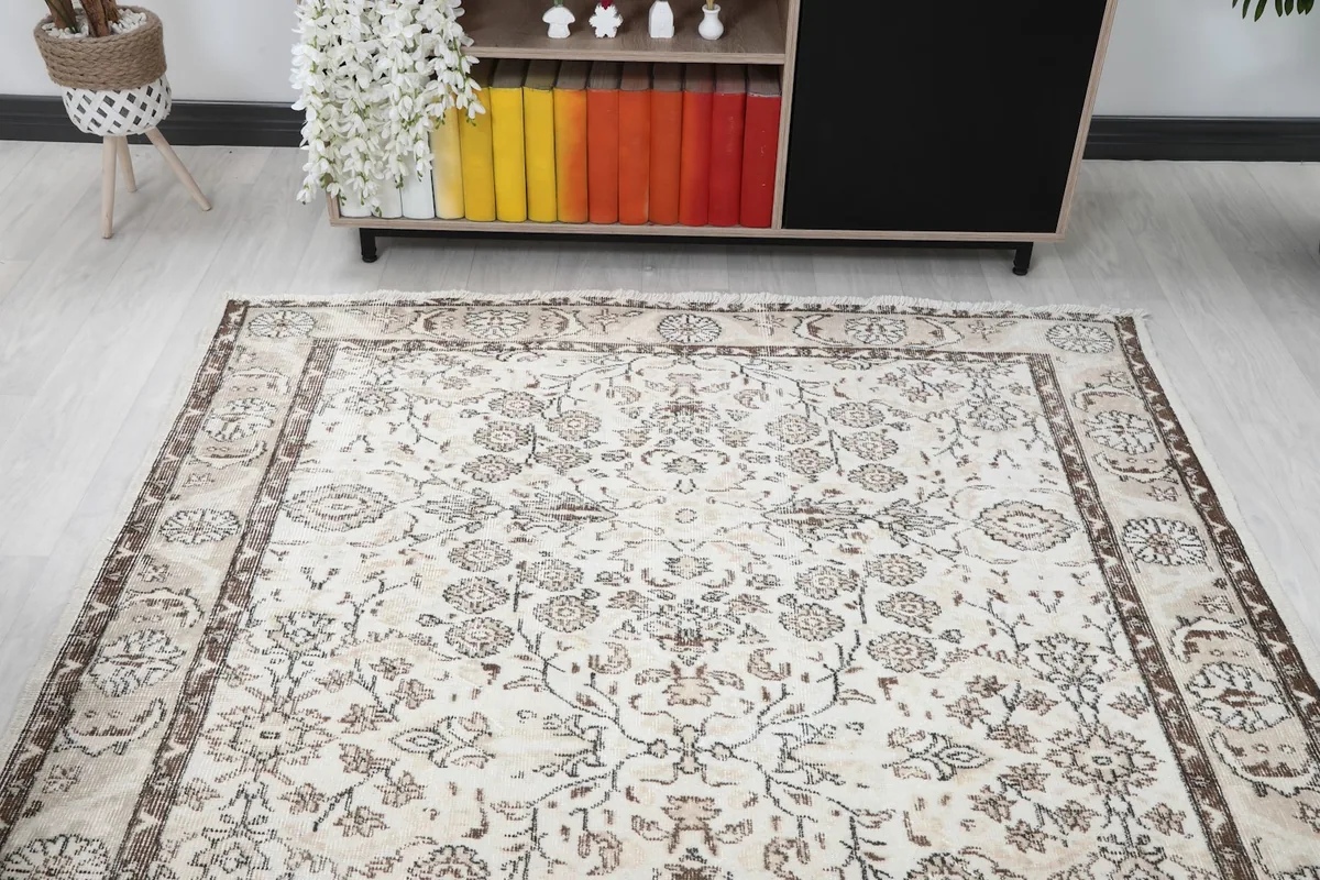Overhead view of the ivory rug in a room, showing its full length and width