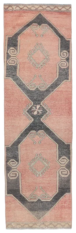 Full top view of the vintage Anatolian runner rug with rose field and charcoal geometric pattern.