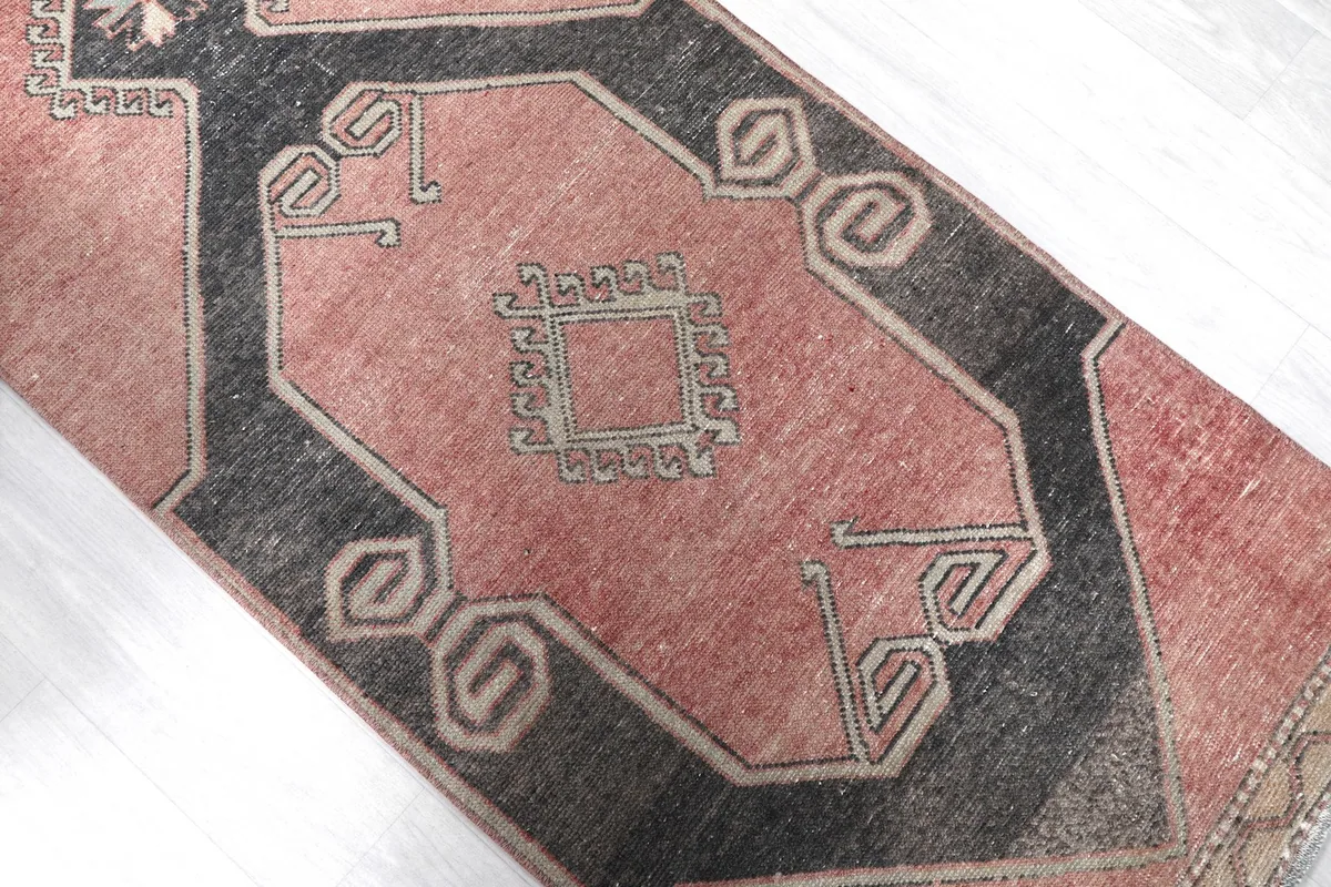 Angled view focusing on the central geometric motifs and the rose field color variations.