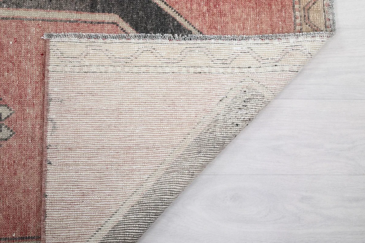 Another view of the rug's back, revealing the intricate knotting and structure.