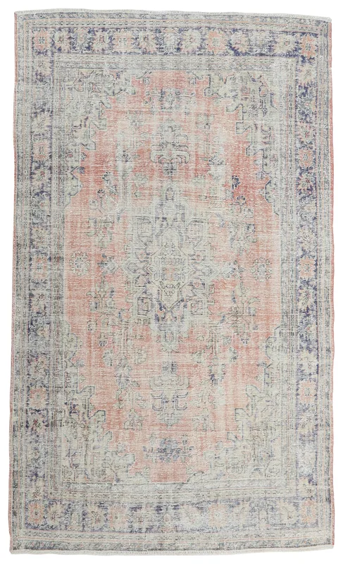 Full top view of the 6'5" x 9'2" hand-knotted vintage Anatolian rug with a rust field and navy border on a white background.