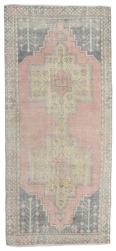 Full top view of the 4x8 pink and beige Anatolian vintage area rug