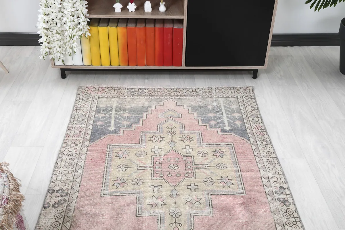 Overhead view of the vintage Anatolian rug in a room setting, highlighting its full design