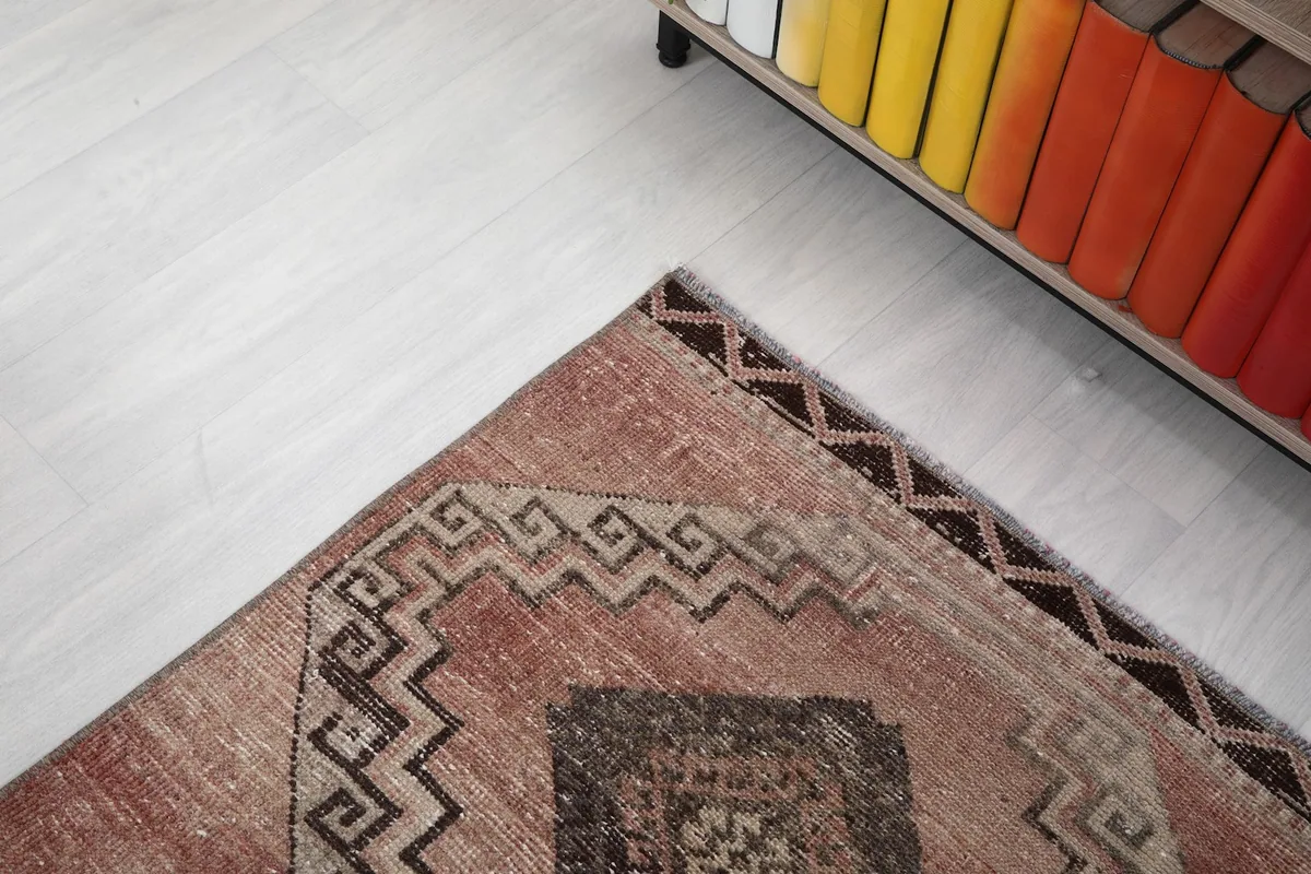 Corner view of the runner rug, highlighting the border and geometric elements