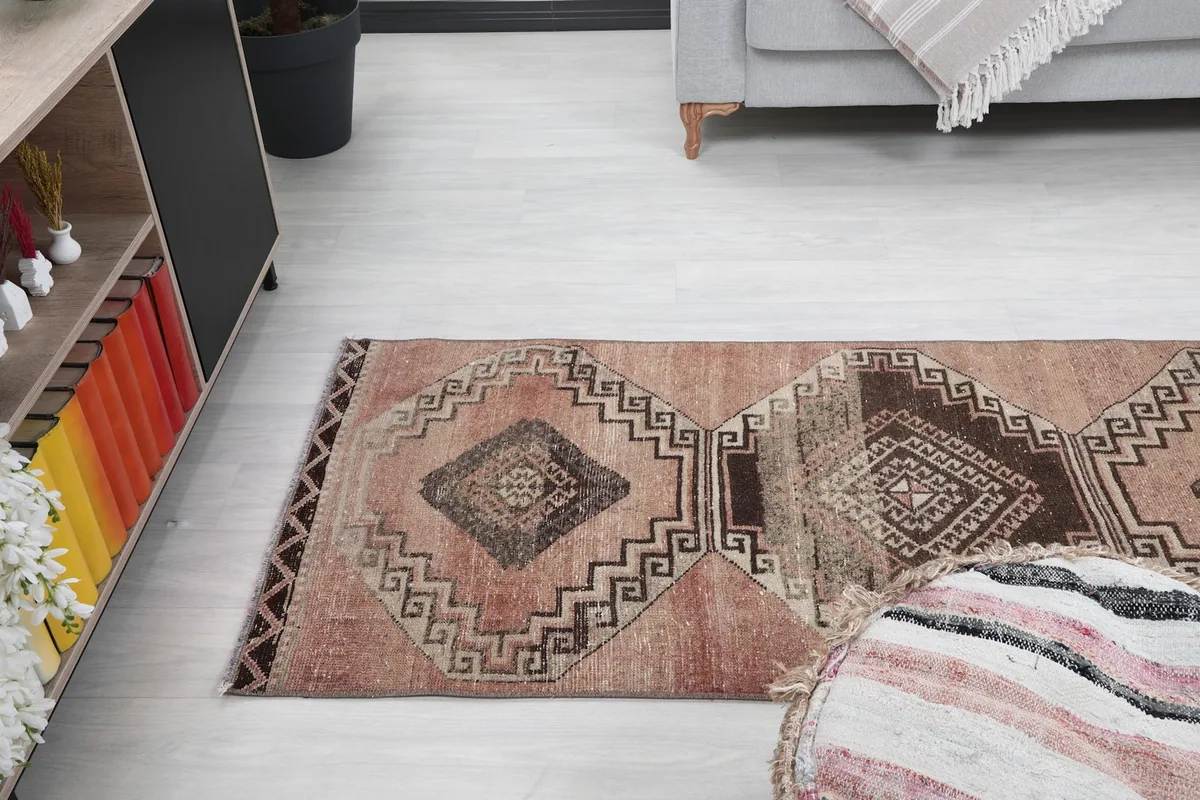 Angled view of the rose runner rug from above, showing its placement in a room