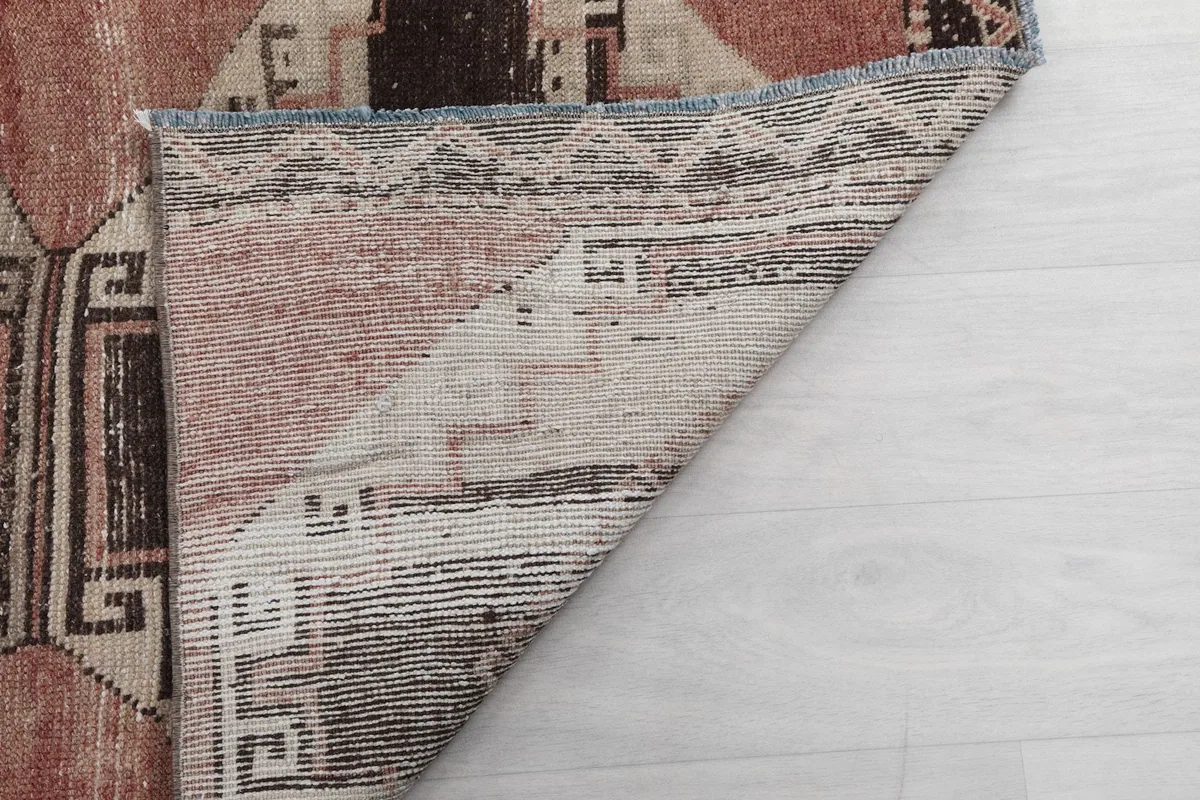 Another folded corner view, showing the reverse side and the construction of the rug