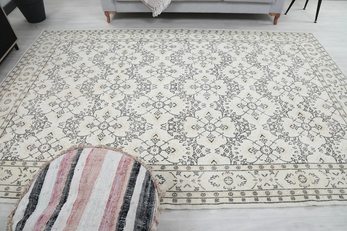 Wide shot of the rug from another angle in the room, emphasizing its size and placement