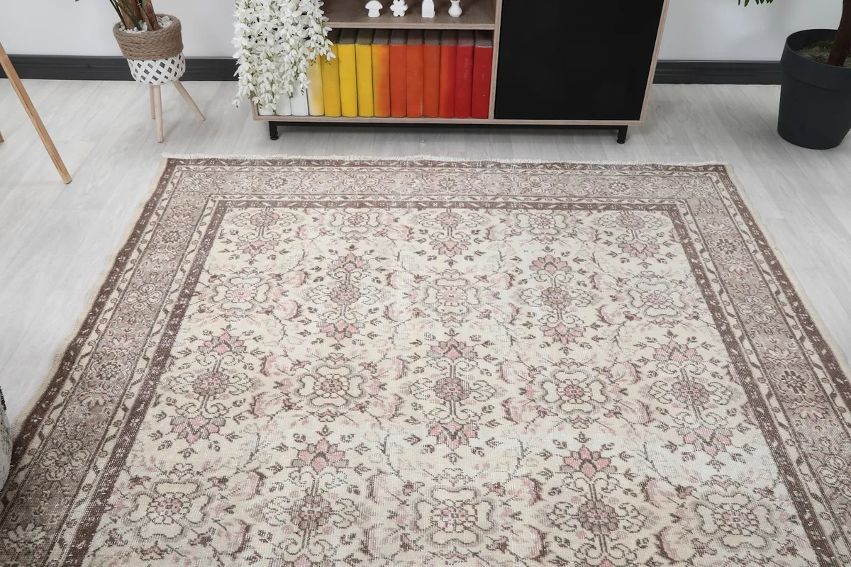 View of the large area rug from the front, demonstrating its presence in a spacious room.
