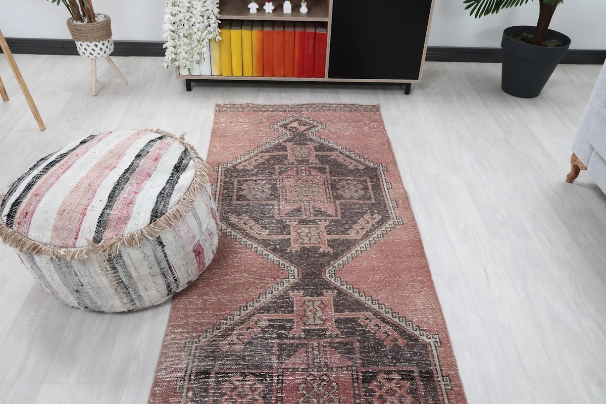 Overhead view of the runner rug placed in a room, showcasing its full pattern and scale.