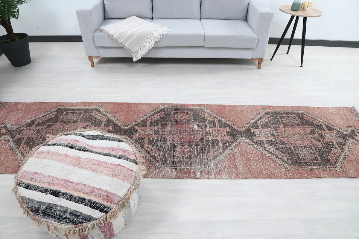 Overhead view of the entire runner rug as it lies in a room, emphasizing its length and design.