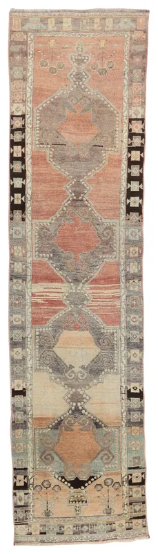 Full top view of a vintage hand-knotted Anatolian runner rug with rust, gray, and beige geometric patterns.