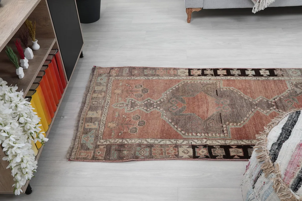 Angled view of the runner rug from above, capturing the full length of the design.