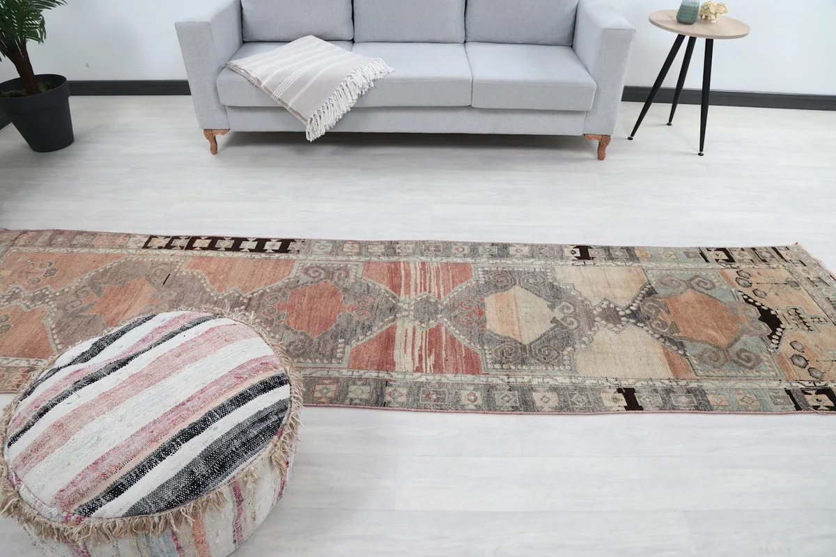 Runner rug extending through a room, emphasizing its long, narrow dimensions.