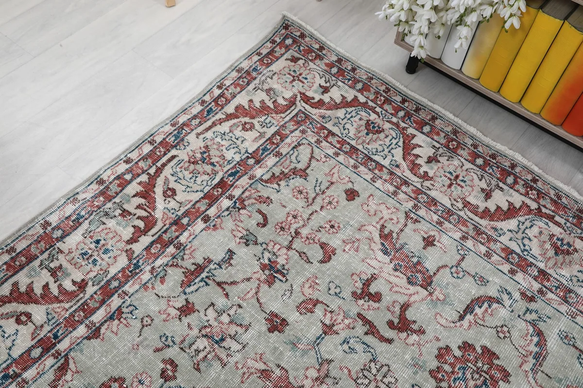 Corner detail of the rug's border and field patterns in a room