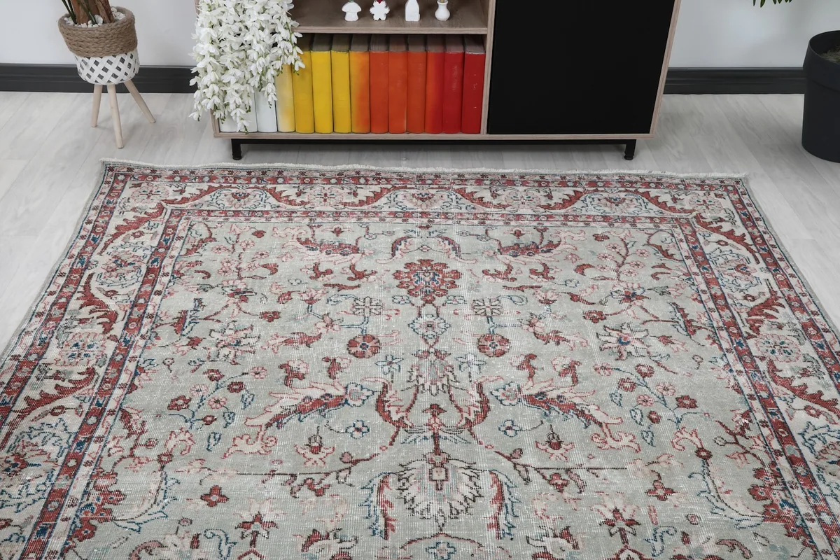 Overhead view of the vintage rug in a room, showcasing its full pattern
