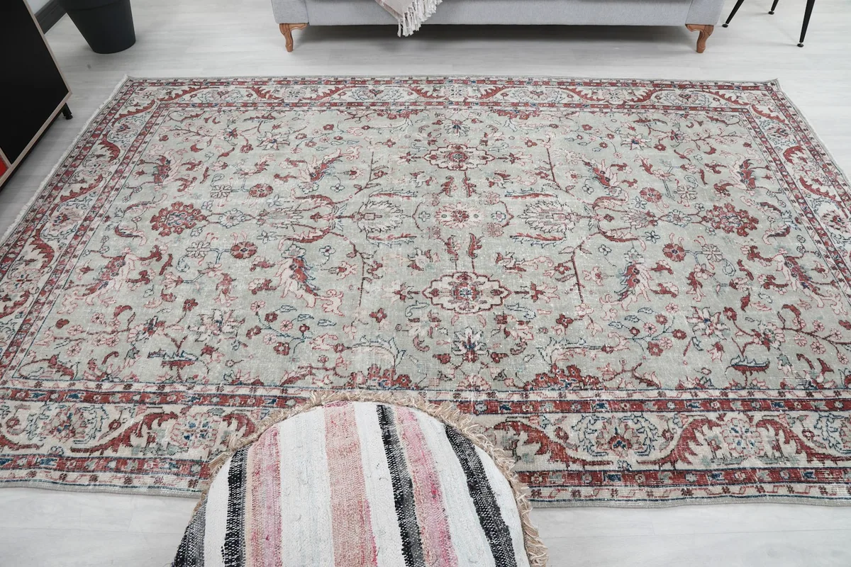 Full view of the rug laid out in a room, showing its scale and design