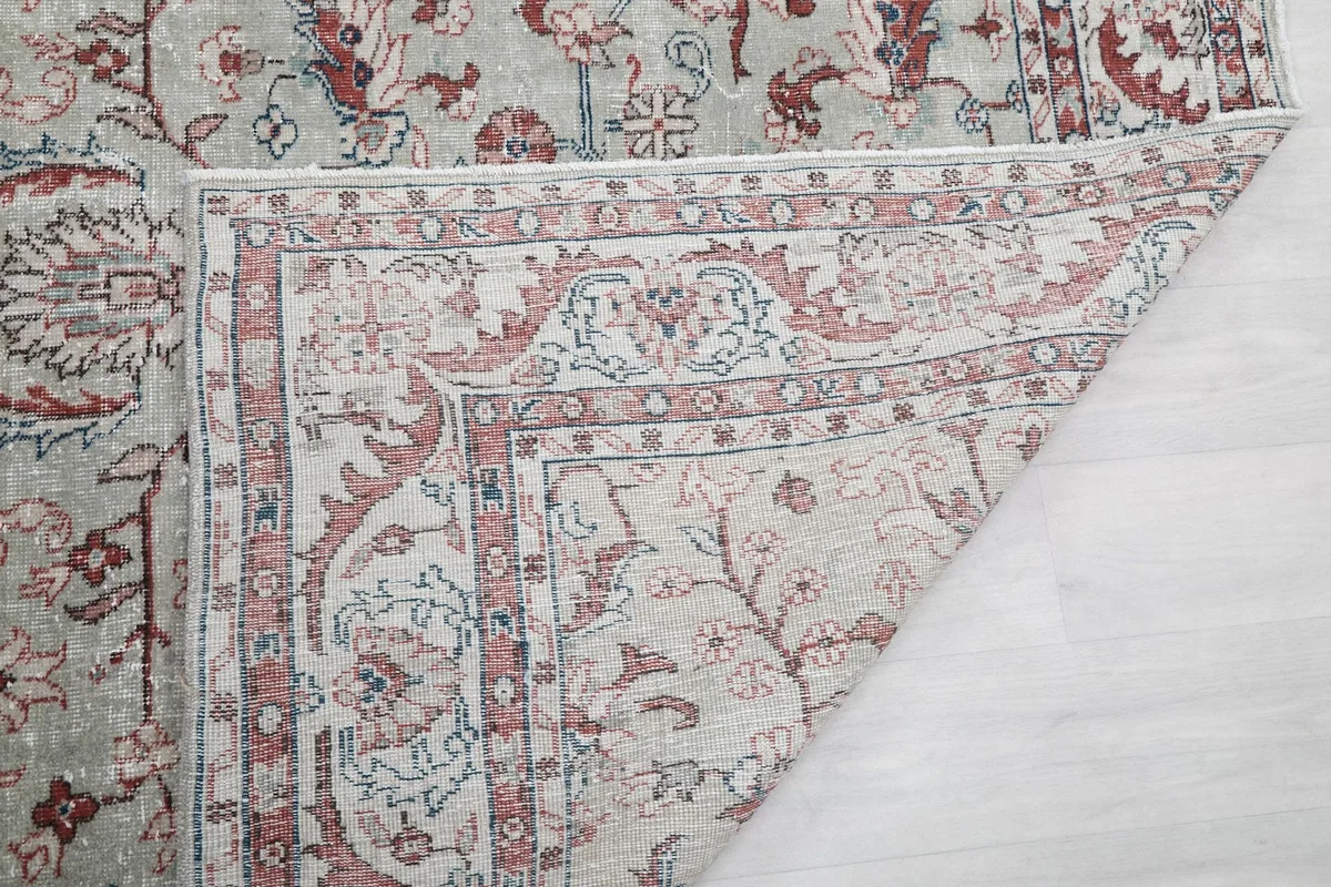 Close-up of the rug's underside, showing the weaving and material quality