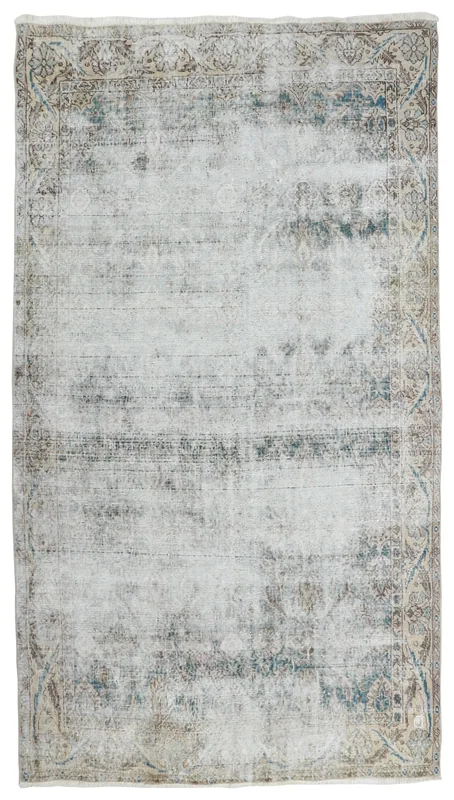 Full top view of the 6'3" x 9'5" gray and beige distressed vintage Anatolian rug
